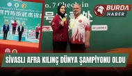 Çin'den altın madalyayla dönen Afra Kılınç, meşalelerle karşılandı.