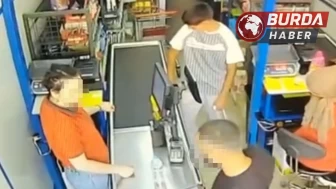 Marketin kadın kasiyerine yumruk atıp burnunu kırdı.