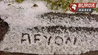 Afyonkarahisar'da yağan dolu kara yolunu beyaza bürüdü
